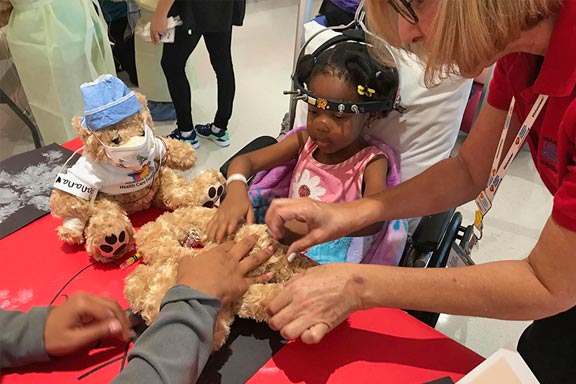 girl with golden teddy bear