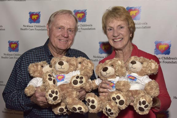 Jack and Barbara with golden teddy bears