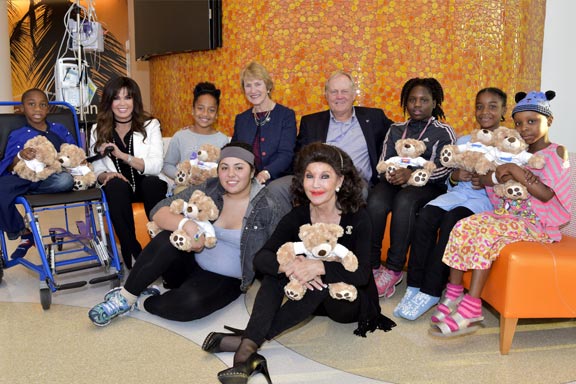 Barbara and Jack with families and golden teddy bears